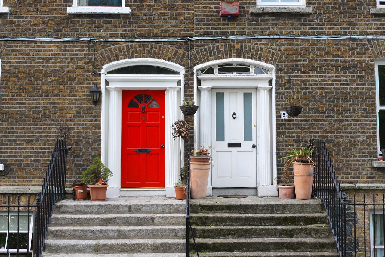 Brick building with red and white doors
