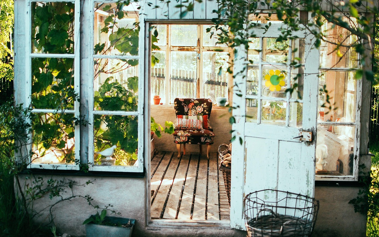 Windowed room with floral chair and greenery