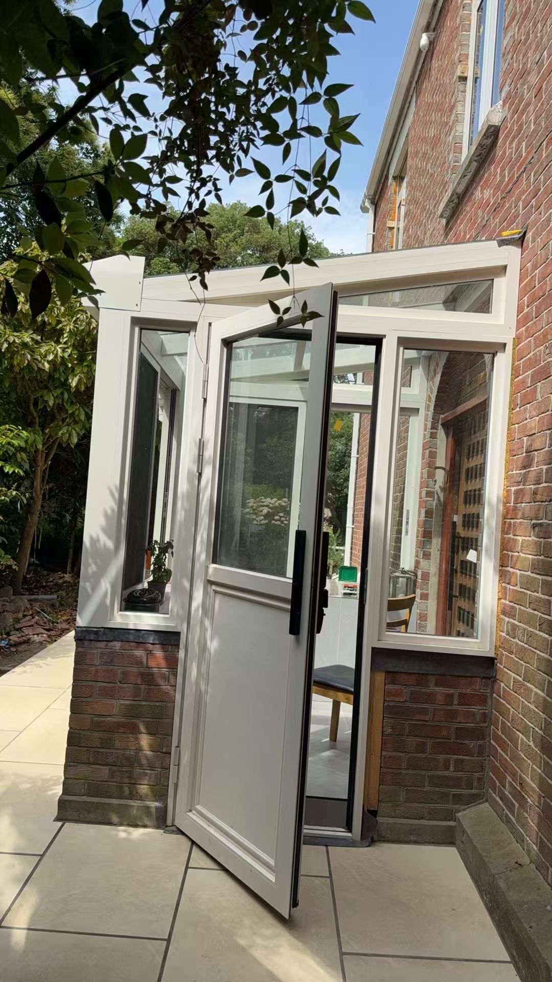Interior glass door and transom window system for a Jersey Island home
